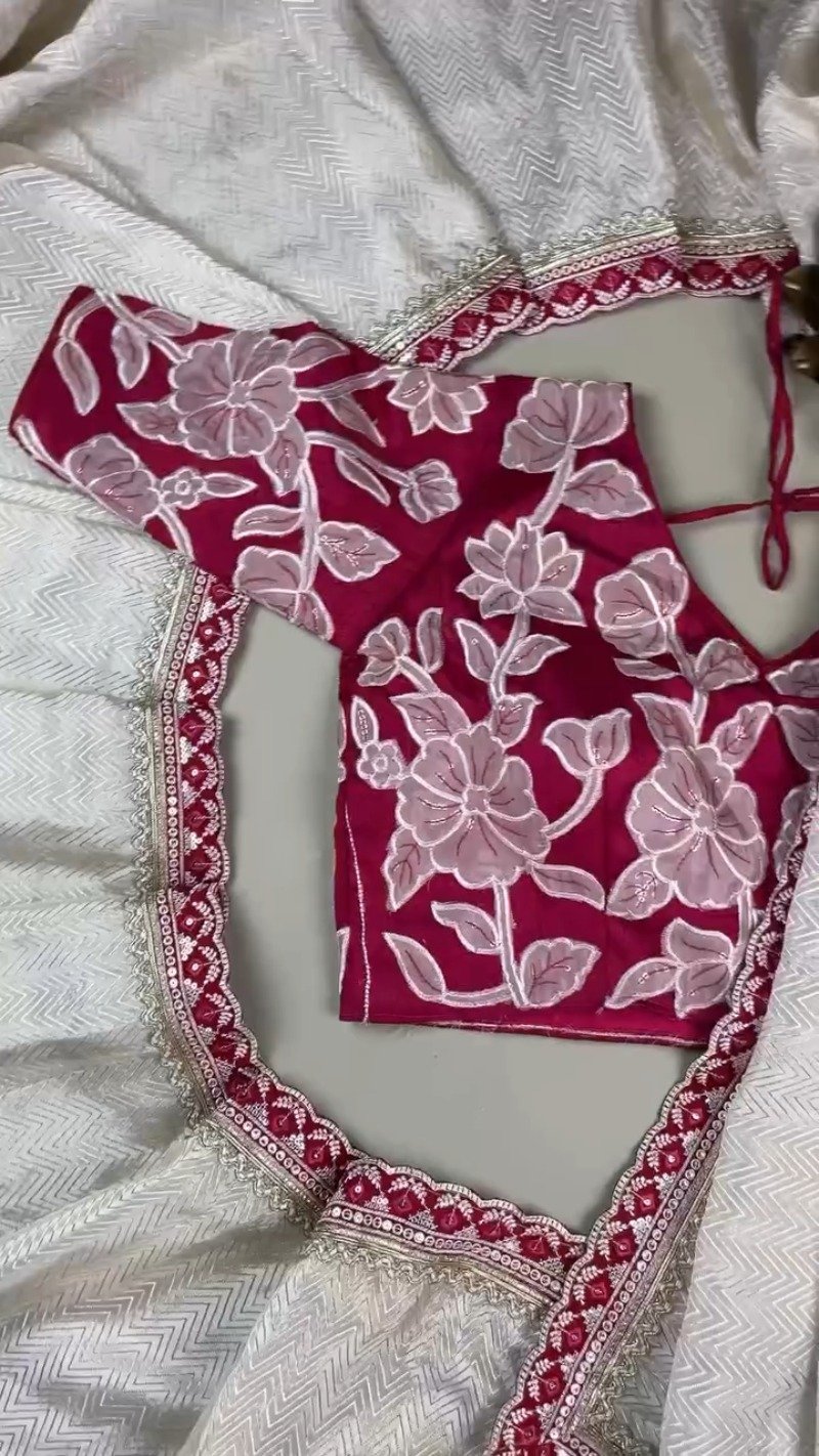 Ivory Chevron Pattern Saree with Embellished Deep Magenta Blouse β Elegant Festive Drape